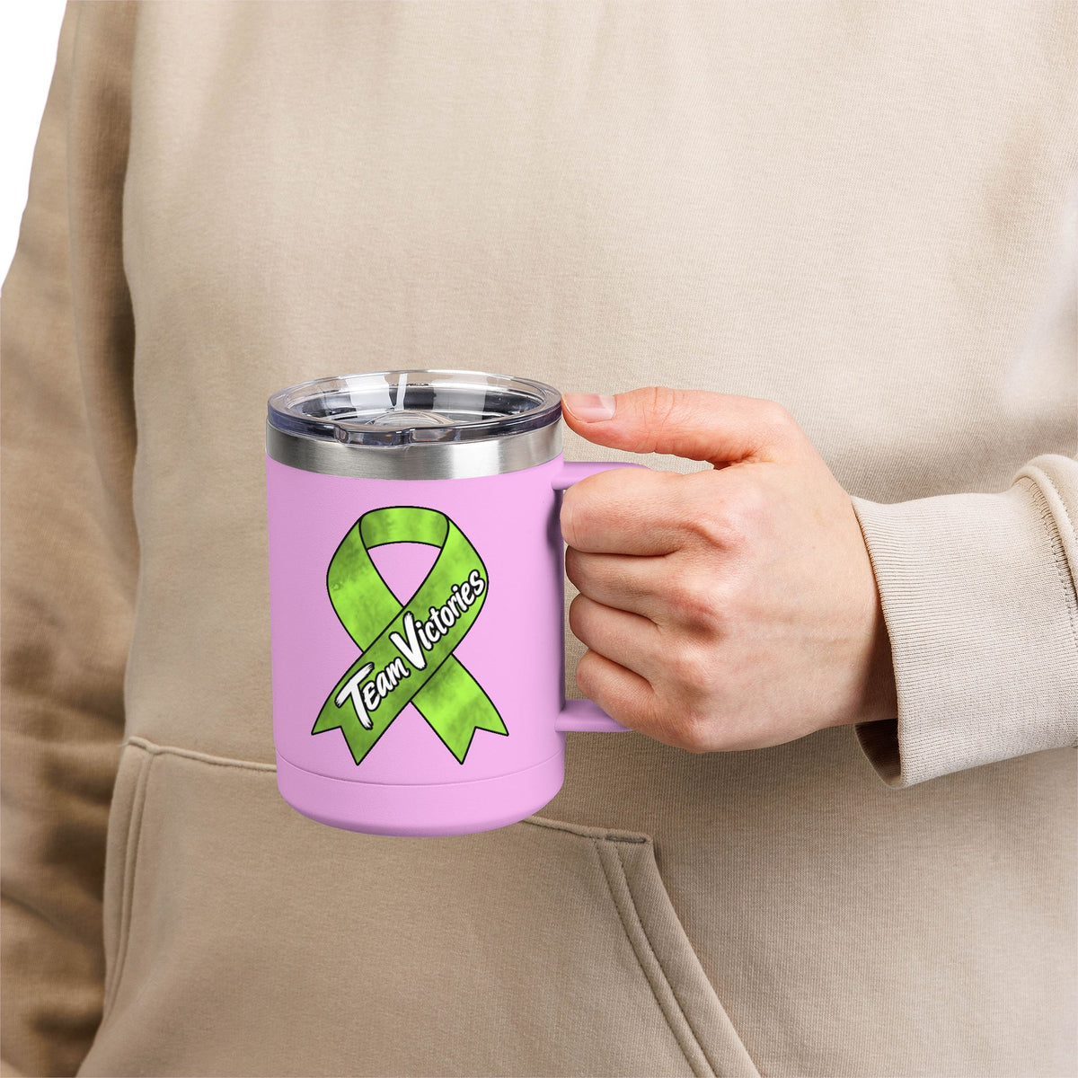 Person holding pink Team Victories mug with Non-Hodgkin/Lymphoma Cancer awareness ribbon