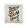 Moooove Over Cancer woven cushion with cow character and blue ribbon, front view