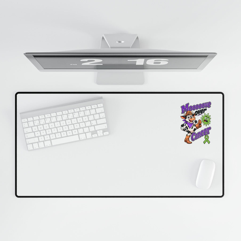 Moooove Over Cancer large mouse pad beneath a monitor with keyboard and mouse