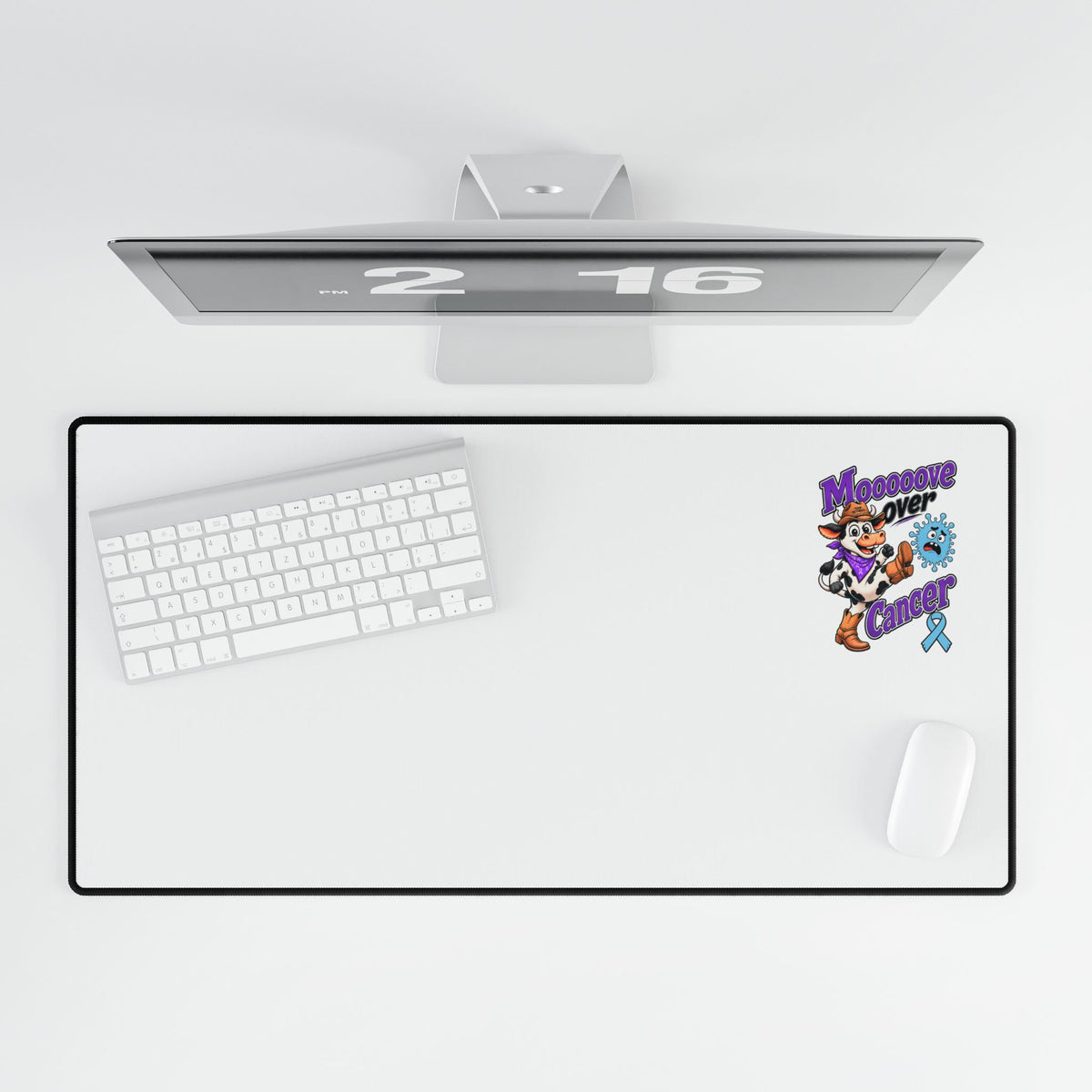 Moooove Over Cancer desk mat shown with a keyboard and mouse from above