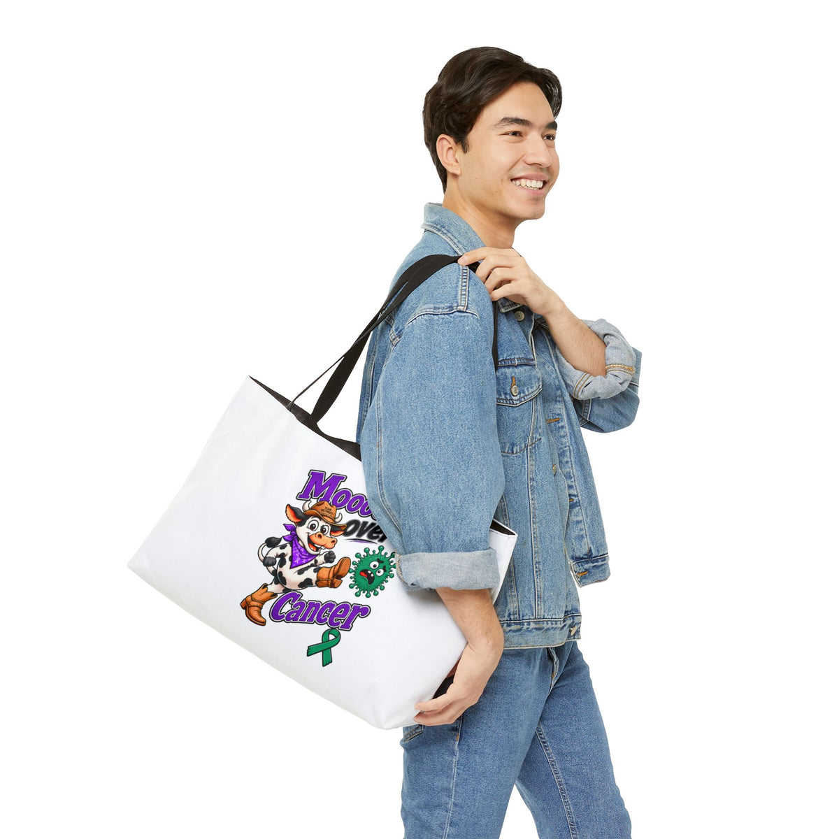 Moooove Over Cancer weekender tote carried by a person in a denim jacket